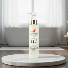 Hairgen hair loss shampoo bottle on a marble stand with a blurred bathroom background