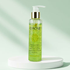 Green bottle of D'Acne facial foam on a light green background