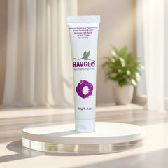Havgro skin brightening cream tube on a white platform with a blurred background