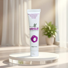 Havgro skin brightening cream tube on a white platform with a blurred background